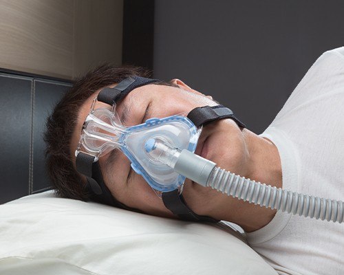 close up of man with cpap mask on