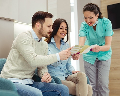 couple looking at insurance paperwork