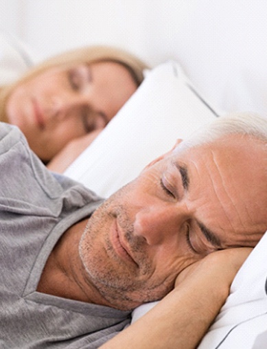 Couple sleeping peacefully after laser snoring treatment in Las Vegas