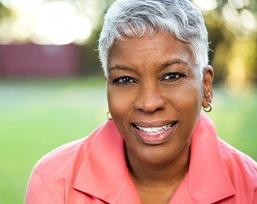 woman smiling outside