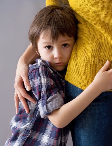 boy hugging mother