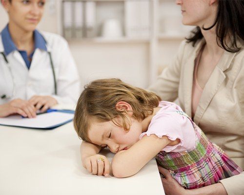 girl sleeping on counter