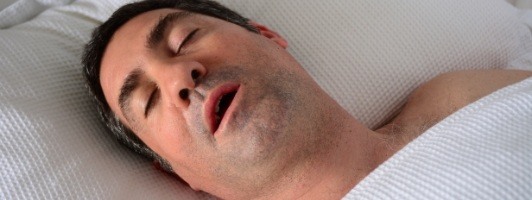 man sleeping and snoring