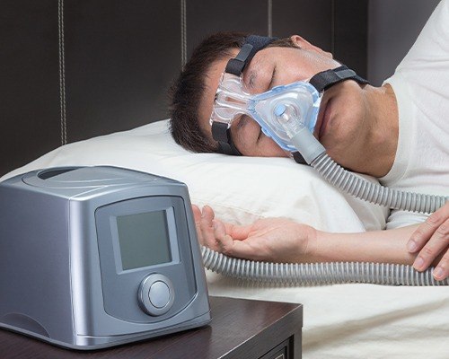 cpap machine on mans face