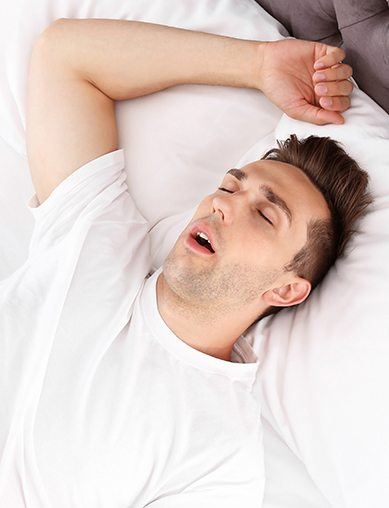 man sleeping with mouth wide open