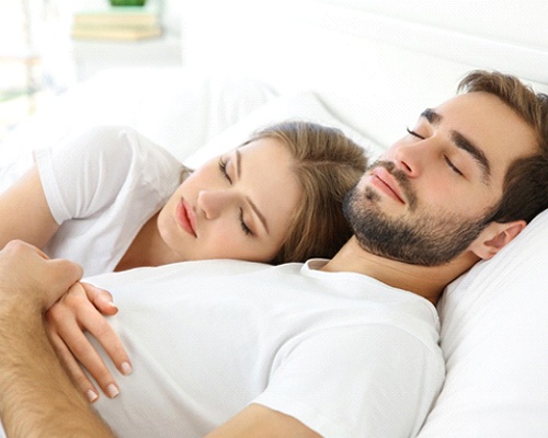 Couple sleeping peacefully thanks to laser snoring treatment