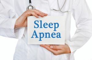 Doctor holding sleep apnea sign