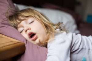 Child sleeping with her mouth open