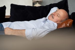 Sleeping man, unconcerned about relationship between napping and sleep apnea