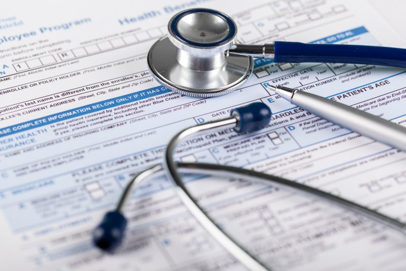 Stethoscope on a health insurance form