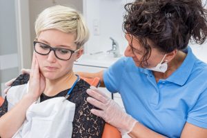 Woman at dentist for jaw pain