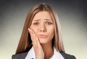 Woman with jaw pain