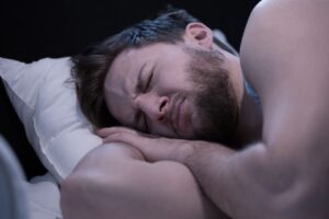 Man frowning in his sleep